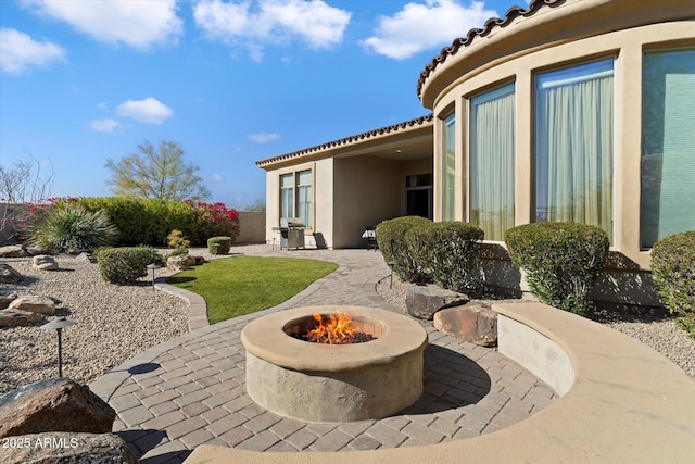 view of patio / terrace featuring a fire pit