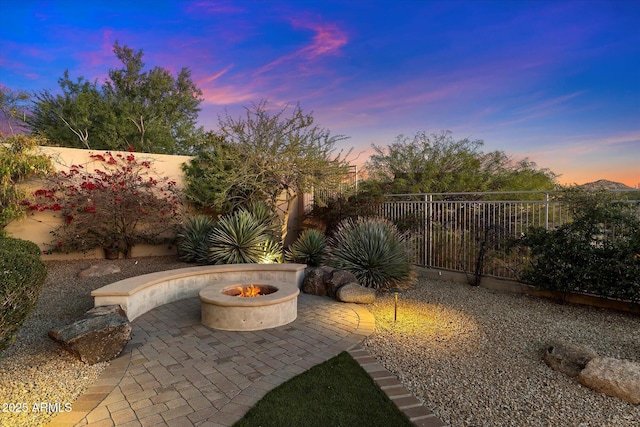 patio terrace at dusk with a fire pit