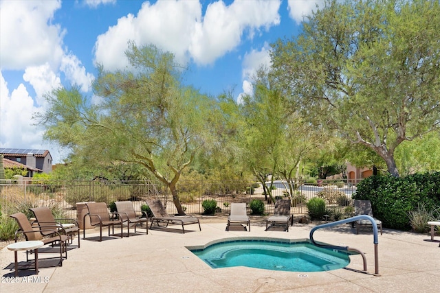 view of swimming pool with a patio area