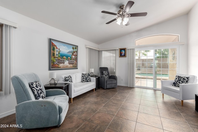 living room featuring ceiling fan and vaulted ceiling