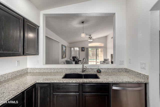 kitchen with light stone countertops, ceiling fan, sink, dishwasher, and lofted ceiling