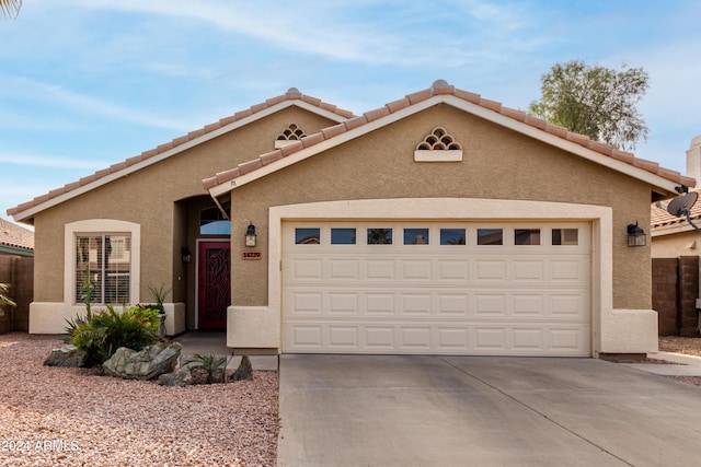 view of front of property featuring a garage