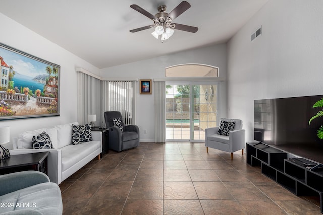 tiled living room featuring ceiling fan and vaulted ceiling