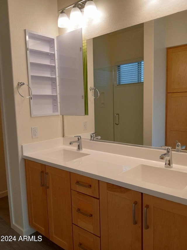 bathroom with vanity and an enclosed shower