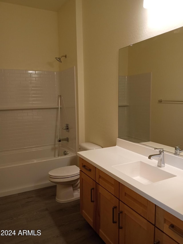 full bathroom with vanity, shower / bathtub combination, toilet, and wood-type flooring