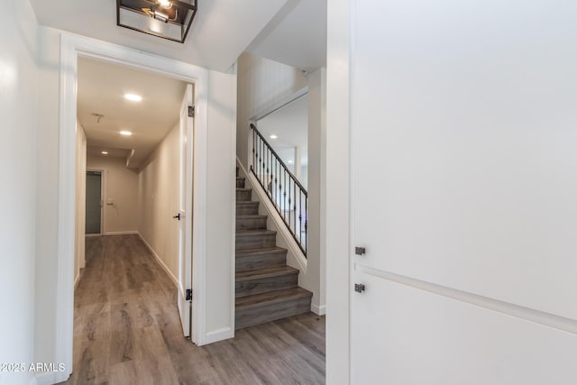 interior space featuring wood finished floors and baseboards