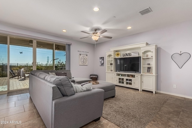 living area featuring baseboards, visible vents, a ceiling fan, and recessed lighting