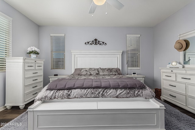 bedroom featuring dark wood-style floors and ceiling fan