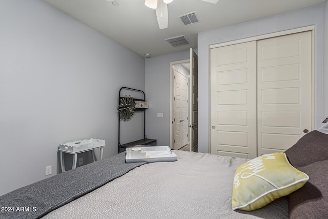 bedroom featuring a closet, visible vents, and ceiling fan