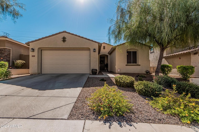 10637 W Eucalyptus Rd, Peoria, AZ 85383 - view of front of house featuring an attached garage, driveway, and stucco siding