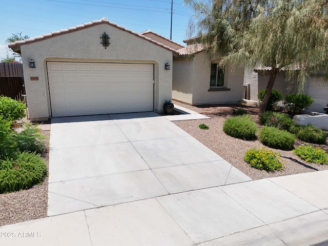 10637 W Eucalyptus Rd, Peoria, AZ 85383 - view of front of property featuring stucco siding, a tiled roof, concrete driveway, and a garage