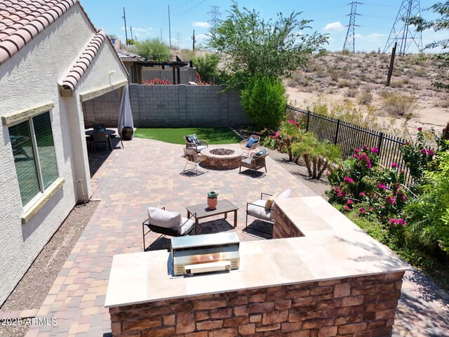 10637 W Eucalyptus Rd, Peoria, AZ 85383 - fenced backyard with a patio area and an outdoor living space with a fire pit