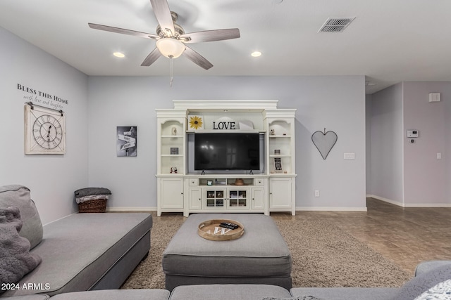 living area featuring baseboards, a ceiling fan, visible vents, and recessed lighting