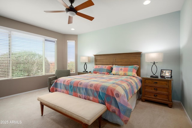 bedroom with recessed lighting, baseboards, and light carpet