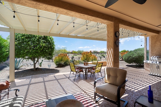 view of patio / terrace featuring a pergola and outdoor dining space