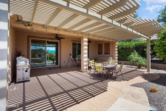 view of patio with fence, a pergola, outdoor dining area, and ceiling fan