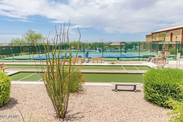 view of property's community with tennis court