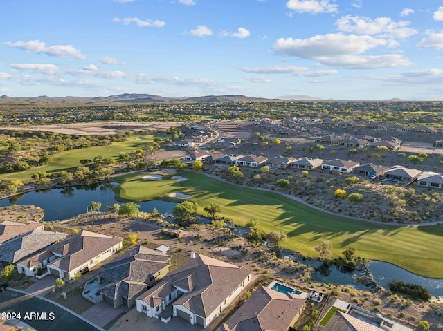 birds eye view of property featuring a water and mountain view