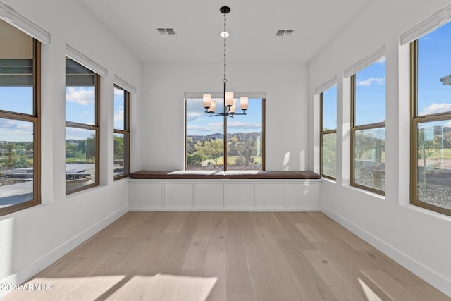 unfurnished sunroom with a chandelier