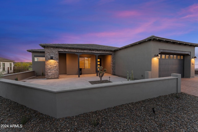 view of front of property featuring a garage