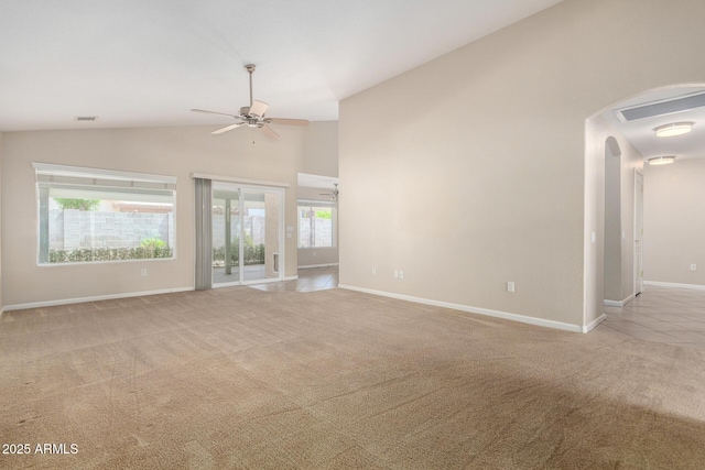 1625 E Daisy St, Casa Grande, AZ 85122 - unfurnished living room featuring a ceiling fan, light carpet, arched walkways, baseboards, and high vaulted ceiling