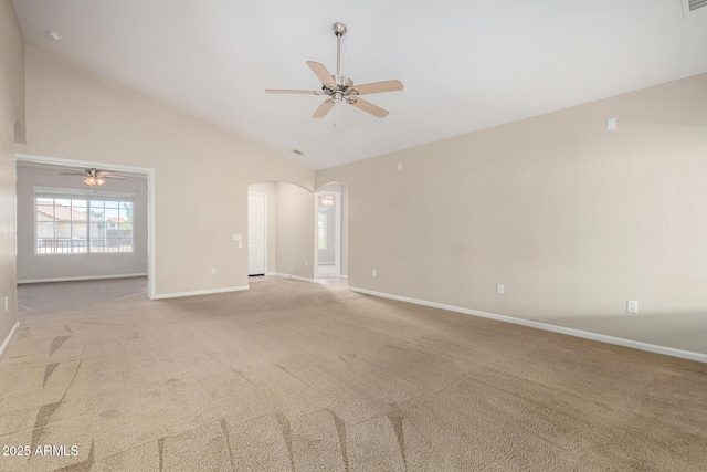 1625 E Daisy St, Casa Grande, AZ 85122 - empty room featuring ceiling fan, arched walkways, light colored carpet, baseboards, and high vaulted ceiling