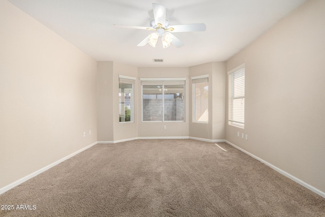 1625 E Daisy St, Casa Grande, AZ 85122 - carpeted spare room with a ceiling fan and baseboards
