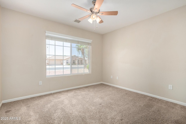 1625 E Daisy St, Casa Grande, AZ 85122 - unfurnished room featuring carpet floors, baseboards, and a ceiling fan