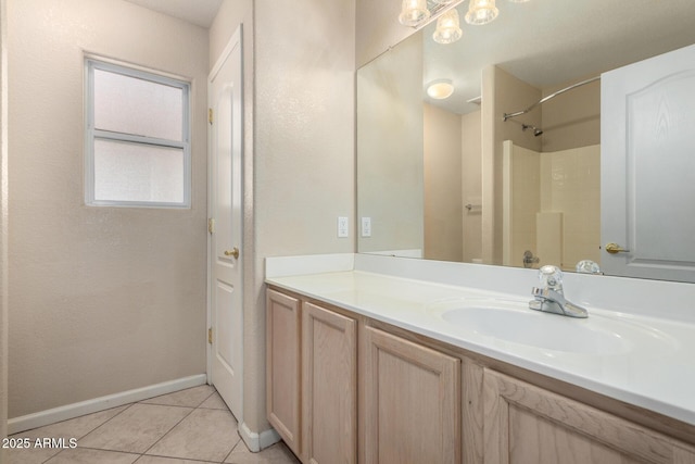 1625 E Daisy St, Casa Grande, AZ 85122 - bathroom featuring vanity, tile patterned floors, a shower, and baseboards