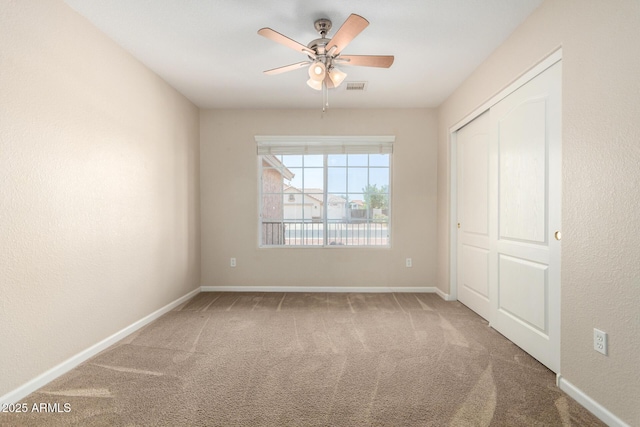 1625 E Daisy St, Casa Grande, AZ 85122 - unfurnished bedroom featuring carpet, a closet, baseboards, and ceiling fan