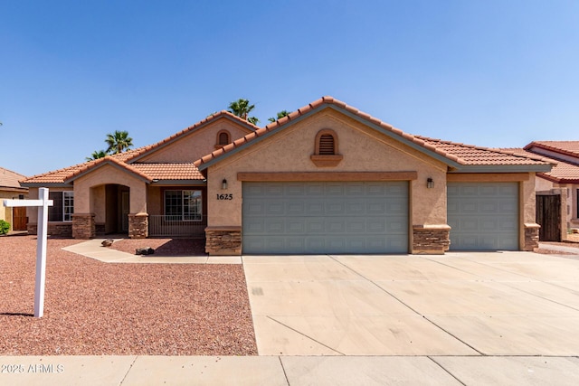 1625 E Daisy St, Casa Grande, AZ 85122 - mediterranean / spanish home with stone siding, a garage, stucco siding, driveway, and a tile roof