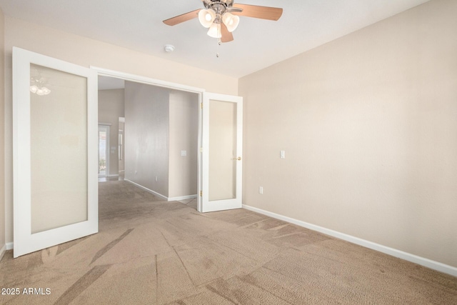 1625 E Daisy St, Casa Grande, AZ 85122 - unfurnished bedroom with carpet, baseboards, french doors, lofted ceiling, and a ceiling fan