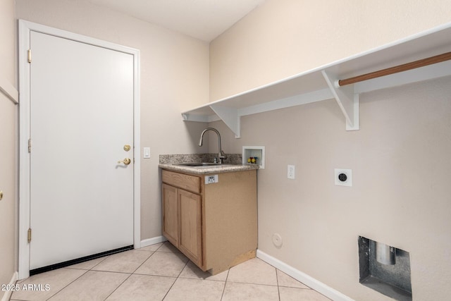 1625 E Daisy St, Casa Grande, AZ 85122 - washroom with hookup for a washing machine, electric dryer hookup, light tile patterned flooring, and baseboards