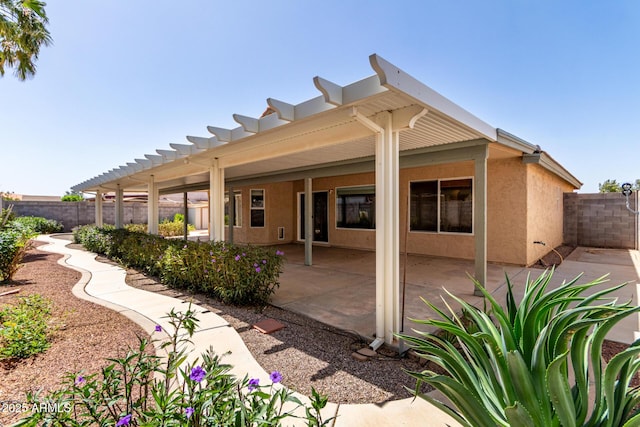 1625 E Daisy St, Casa Grande, AZ 85122 - back of house featuring a fenced backyard, a patio area, and stucco siding