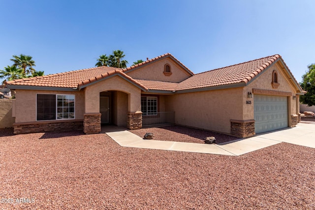 1625 E Daisy St, Casa Grande, AZ 85122 - mediterranean / spanish house with stucco siding, a garage, stone siding, and driveway
