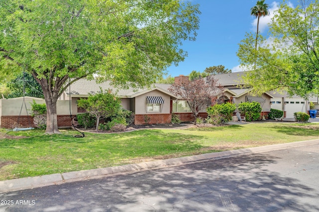 5621 N 13th St, Phoenix, AZ 85014 - view of front facade with brick siding, a front lawn, a chimney, and stucco siding