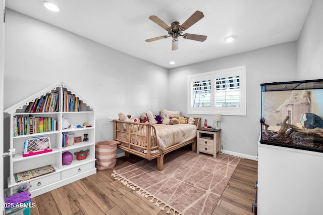 5621 N 13th St, Phoenix, AZ 85014 - bedroom with wood finished floors, recessed lighting, a ceiling fan, and baseboards