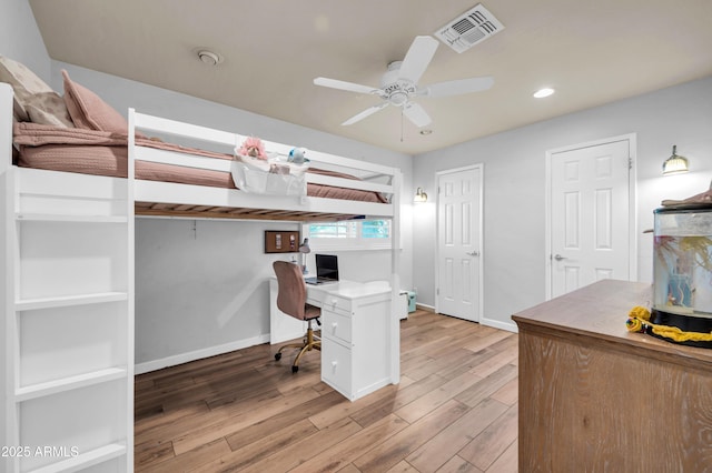 5621 N 13th St, Phoenix, AZ 85014 - bedroom with a desk, light wood-style floors, baseboards, and recessed lighting