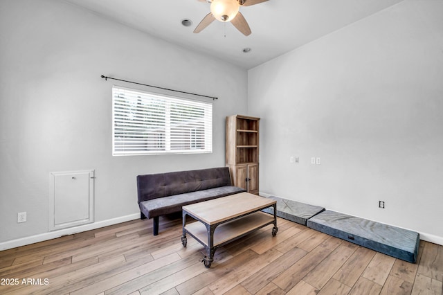 5621 N 13th St, Phoenix, AZ 85014 - living area featuring wood finished floors, ceiling fan, and baseboards