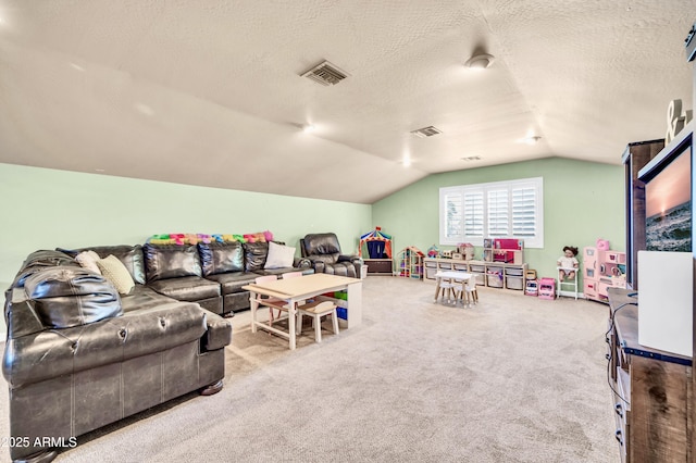 5621 N 13th St, Phoenix, AZ 85014 - living room featuring vaulted ceiling, carpet, and a textured ceiling