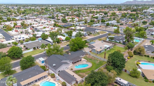 5621 N 13th St, Phoenix, AZ 85014 - aerial view of property's location with a pool, a mountainous background, and nearby suburban area