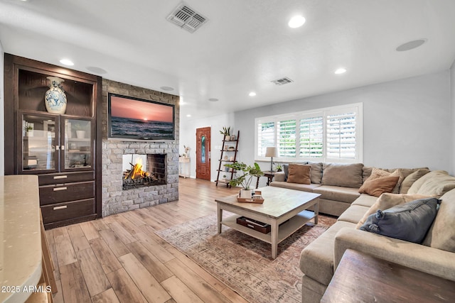 5621 N 13th St, Phoenix, AZ 85014 - living area with wood finished floors, a fireplace, and recessed lighting