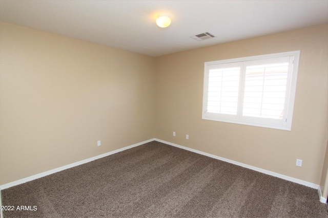 unfurnished room with carpet floors