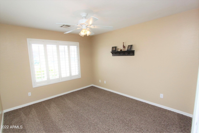 empty room with carpet flooring and ceiling fan