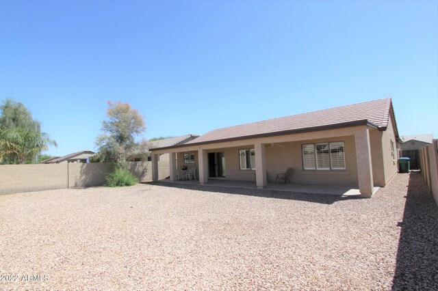 rear view of house featuring a patio and central AC unit