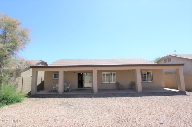 rear view of house with a patio