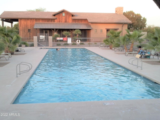 view of pool featuring a patio