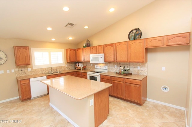 kitchen with vaulted ceiling, backsplash, a center island, white appliances, and light tile floors