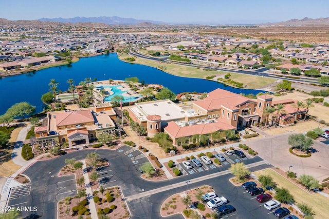 bird's eye view with a water and mountain view