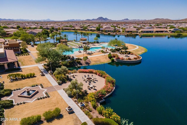 bird's eye view with a water and mountain view